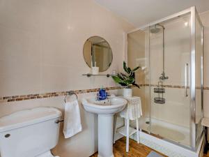 a bathroom with a toilet and a sink and a shower at 8 Bed in Bristol oc-87469 in Winterbourne +26 photos