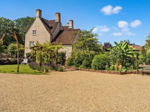 a house with a gravel driveway in front of it at 8 Bed in Bristol oc-87469 in Winterbourne