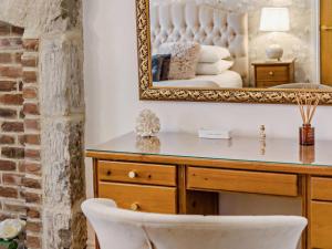 a room with a mirror and a desk with a chair at 2 Bed in Morpeth oc-91206 in Amble +18 photos