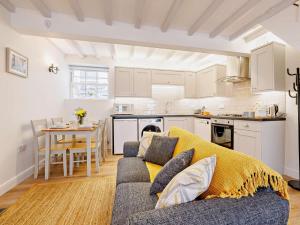 a living room with a couch and a kitchen at 2 Bed in Aberdovey oc-91962 in Aberdyfi +15 photos