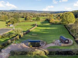 an aerial view of a large field with a barn at 1 Bed in Hereford oc-93440 in Little Dewchurch