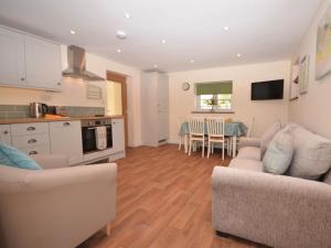 a kitchen and living room with a couch and a table at 2 Bed in Bristol oc-75697 in Bristol