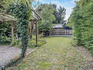 a garden with a pergola and a fence at 2 Bed in Oswestry oc-76537 in Gobowen +16 photos