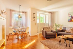 a living room with a couch and a table at Klippenblick in Schierke