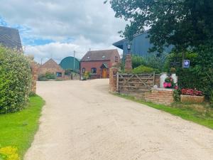 a dirt road in a village with houses at 1 Bed in Shrewsbury oc-77906 in Leighton