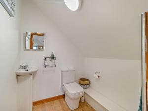 a white bathroom with a toilet and a sink at 1 Bed in Bristol oc-72835 in Chew Magna +9 photos