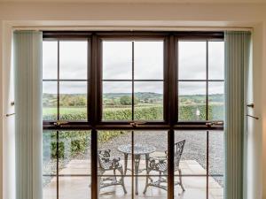 a room with a window with a table and chairs at 1 Bed in Bristol oc-72835 in Chew Magna