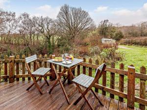 a table and chairs on a wooden deck at 1 Bed in Leighton oc-80727 in Leighton
