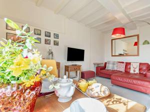 a living room with a couch and a table at 1 Bed in Kidderminster oc-82957 in Cleobury Mortimer