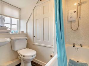 a bathroom with a toilet and a sink and a shower at 1 Bed in Kidderminster oc-82957 in Cleobury Mortimer +13 photos