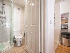 a bathroom with a toilet and a glass shower at 2 Bed in Aberdyfi oc-dy047 in Aberdyfi +17 photos