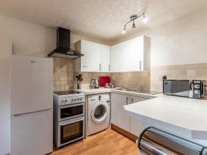 a kitchen with a dishwasher and a washer at 2 Bed in High Peak oc-pk551 in Hayfield