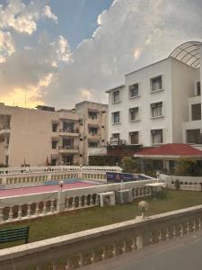 a view of a city with buildings and a train at Garden view by Midtown in Katra