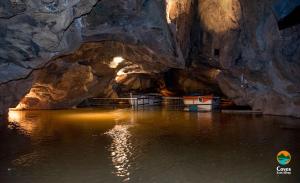 a boat in the water in a cave at Luz del Mediterráneo in Moncófar
