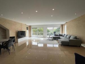 a large living room with a couch and a table at Stylish spacious residence in Düsseldorf in Düsseldorf