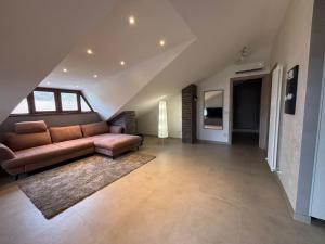 a living room with a couch and a rug at Apartment Jasmina in Venzone