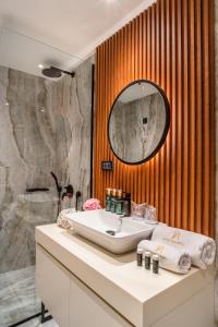 a bathroom with a sink and a mirror at Boutique Hotel Villa Royal in Tivat +17 photos