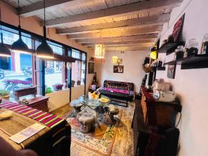 a living room with a table and a couch at Hotel Dancing Yak in Jomsom