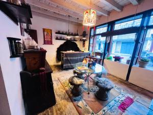 a living room with a table and a couch at Hotel Dancing Yak in Jomsom