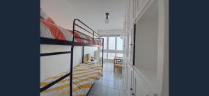a bedroom with a bunk bed and a hallway at Exceptional, 12 minutes RER C from Paris in Juvisy-sur-Orge
