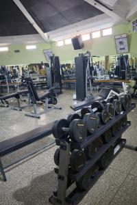 a gym with a bunch of dumbbells at Pivot Studio near Westside mall in Nakuru