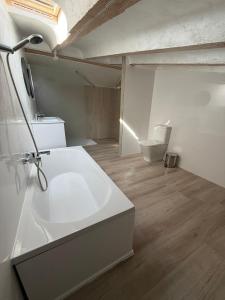 a bathroom with a white sink and a toilet at Apartamentos San Gabriel in Alcalá de Henares +48 photos