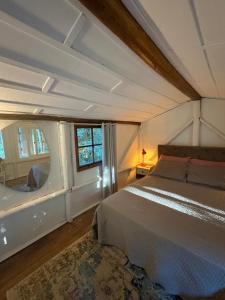 a bedroom with a large bed and a window at Reserva Pedra da Mata in Pelotas +103 photos