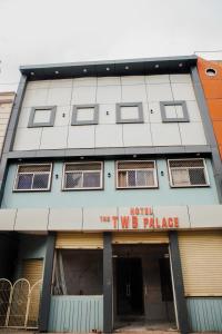 a building with the two b place sign on it at Hotel The TWB palace in Gwalior