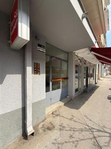 an empty building with a sign on the side of it at Ljiljana in Vršac