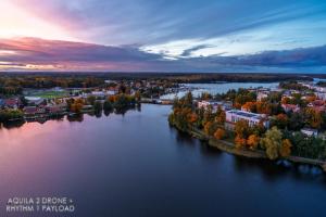 an aerial view of a river with a city at Przystań 21 - Lake View Apartament, bulwar, klimatyzacja, wanna, parking in Iława