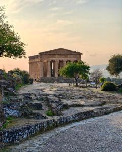 ancient temple on the hill of aphaia at sunset at Mediterranea Apartment in Agrigento