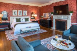a bedroom with a bed and a fireplace at Bohemia Manor Farm in Chesapeake City +150 photos