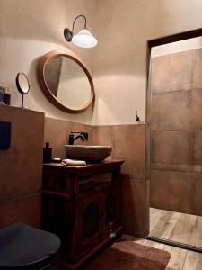 a bathroom with a sink and a mirror at De Oranjehoeve in Holthone +33 photos