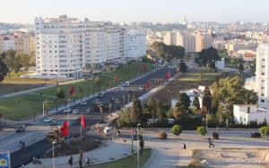 a view of a city with a street and buildings at Moroccan Inspired 2BR Bright, Central & New in Oulad Akkou