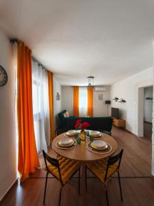 a living room with a table and a couch at Apartman Turkalj in Rakovica