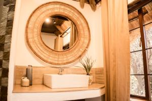 a bathroom with a sink and a mirror at LittleBush Private Lodge in Hoedspruit +58 photos