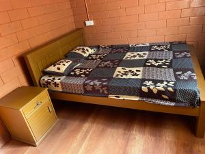 a bed in a room with a bed sidx sidx sidx at Alloos homestay villa in Attappādi