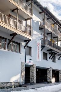 a building with two balconies on the side of it at Pierre & Vacances Andorra Alba in El Tarter