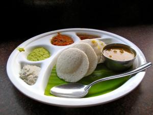 a plate of food with rice and other food items at VMR Hotel Port Blair in Jangli Ghāt