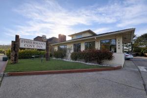 a building with a sign in front of it at Fisherman's Cove Inn in Monterey