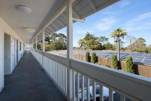 a view from the balcony of a house with solar panels at Fisherman's Cove Inn in Monterey +42 photos