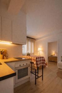 a kitchen with a table with a table cloth on it at Apartament a Sant Celoni, Montseny, Barcelona in Sant Celoni