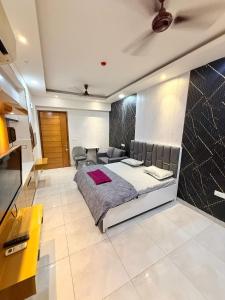 a bedroom with a large bed in a room at Aayu's Home 74 in Noida
