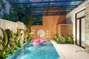 a pool with a pink flamingo in a house at Ocean Hotel in Sầm Sơn