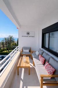 a living room with a couch and a table at panoramic boutique con preciosas vistas in Benalmádena