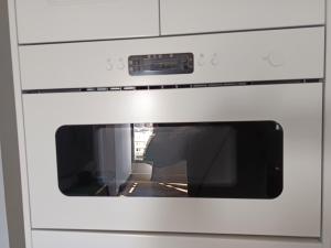 a white oven with a window in it at panoramic boutique con preciosas vistas in Benalmádena