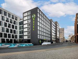 a building with a sign on the side of it at B&B Hotel Düsseldorf-City in Düsseldorf