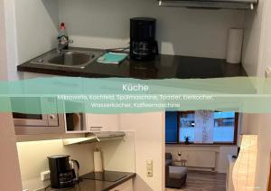 a kitchen with a sink and a counter top at Ferienwohnung Karrasch in Schwangau