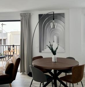 a dining room with a table and chairs at Canaryislandshost l Balcón del Mar in Puerto del Carmen