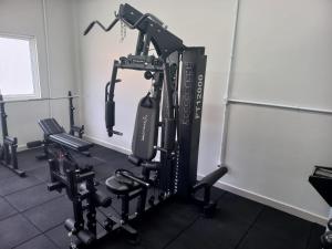 a room with a gym with several tread machines at CALLAI HOTEL in Toledo